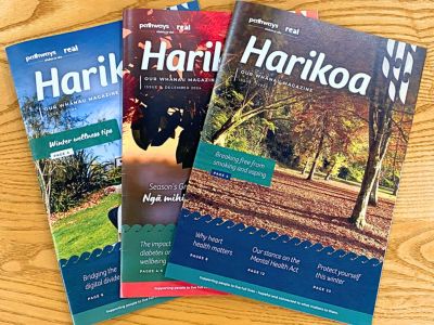 Harikoa magazine collection fanned out on wooden surface